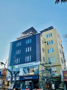 a tall building on the side of a street at Hotel Ananta in Sasarām