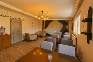 a restaurant with tables and chairs in a room at Leopard edirne in Edirne