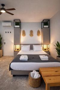 a bedroom with a large bed and a table at Gondola Marine Resort in Ḩālāt +52 photos