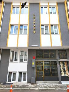 a building with a sign on the front of it at Leopard edirne in Edirne