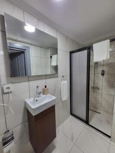 a bathroom with a sink and a shower at Leopard edirne in Edirne +14 photos