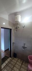 a bathroom with a sink and a faucet at The Valley View Homestay in Lansdowne
