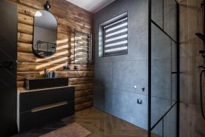 a bathroom with a sink and a mirror at Barn&Haus-Stodoły Widokowe in Zubrzyca Dolna +152 photos