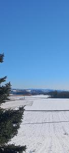 a snow covered field with a snow covered runway at PA's in Oberzirking