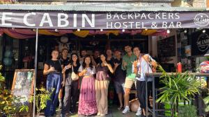 a group of people standing in front of a restaurant at The Cabin Backpackers Hostel & Bar in Chiang Mai +23 photos