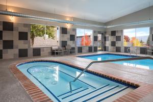 a swimming pool in a house at Garner Hotel Liberty Lake by IHG in Liberty Lake