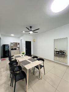 a dining room with a table and chairs at SDC Suite Home 4 in Lahad Datu