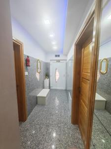 a bathroom with two sinks and two toilets at Apartman Antonela in Sop +9 photos