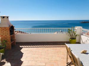 a balcony with a view of the ocean at Casa Eugenia in Sesimbra