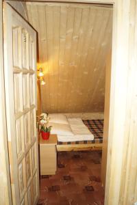 a small room with a bed in a house at CHAŁUPA Pokoje Gościnne in Poronin +73 photos