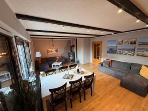 a living room with a couch and a table at Strandgut- die Große in Dranske