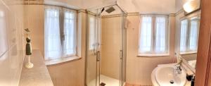 a bathroom with a shower and a sink at Casa Eugenia in Sesimbra +29 photos