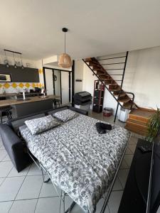 a room with a bed and a staircase in it at Le 305 Beauvert Parking Gratuit in Grenoble