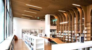 a library with rows of bookshelves at Duplex in Escaudain