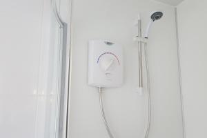 a shower with a shower head in a bathroom at Annie's Bed & Breakfast in South Shields