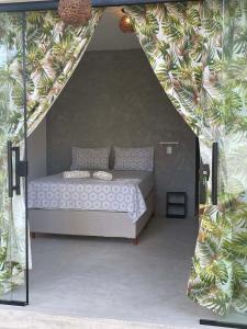 a bedroom with a bed in a tent at Hopa Shelter Surf House Apartamento in Paracuru +105 photos