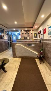 a lobby of a hotel with a reception counter at Hotel Marvel International And Restaurant in Darjeeling