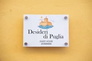 a sign on the side of a building on a wall at Desideri di Puglia in Barletta