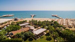 an aerial view of a beach with a marina and boats at Saturn Palace Resort in Lara