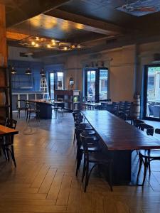 a large dining room with a large wooden table and chairs at Bakuriani Valley in Bakuriani