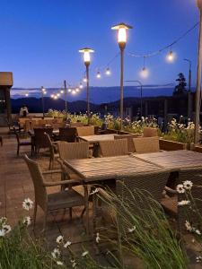 a restaurant with tables and chairs and lights at Bakuriani Valley in Bakuriani
