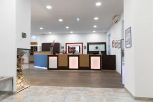 a lobby of a store with a counter in the middle at Hotel Plattenwirt in Klagenfurt