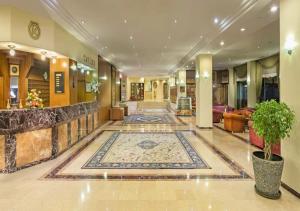 a lobby with a rug on the floor at Özkaymak Incekum Resort - Ultra All Inclusive in Avsallar +58 photos