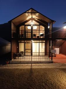 a large house with a lit up facade at night at Shivir Aranya - Wilderness Resort Sariska in Alwar