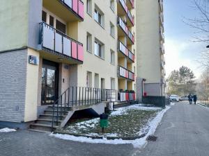 a building with stairs next to a street at CityView Tychy in Tychy