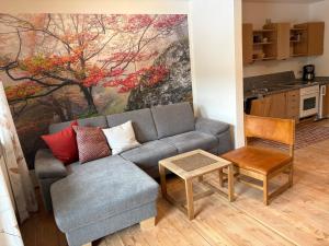 a living room with a couch and a table at Gschwendnerhof Reitberger-Brandl in Röhrnbach