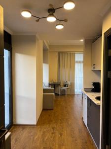 a kitchen and living room with a couch and a table at Alvina 29 in Tsaghkadzor +5 photos