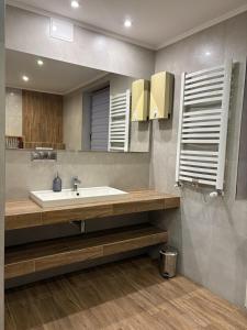 a bathroom with a sink and a mirror at Dom pod Jaworem in Rajcza +54 photos