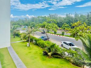 a view of a street with cars parked on the road at New Day Tuy Hòa in Liên Trì (4)