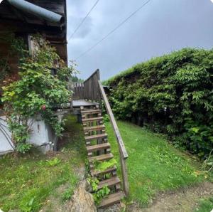 a wooden staircase leading up to a house at petit chalet in Chamonix