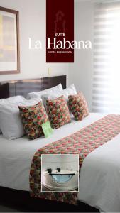 a hotel room with two beds with pillows at Hotel Buena Vista in Bucaramanga