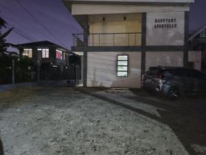 a car parked in front of a house at night at JRC Feel at Home in Puerto Princesa City