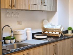 a kitchen with a sink and a counter top at 953 D shore 1 in Manila