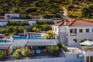 arial view of a house in a city at Panorama Mobilehome Vista Kornati with Pool in Drage