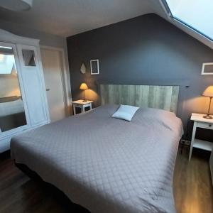 a bedroom with a large white bed and a window at Le Relais De La Motte in Soignies +19 photos