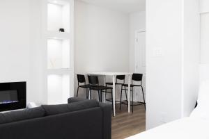 a living room with a table and chairs at Cozy Cove Retreat, Private Suite with Separate Entrance Near Friday Harbour, Barrie & Lake Simcoe in Innisfil
