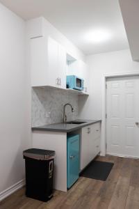 a kitchen with a sink and a counter top at Cozy Cove Retreat, Private Suite with Separate Entrance Near Friday Harbour, Barrie & Lake Simcoe in Innisfil +7 photos