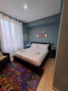 a bedroom with a bed and a rug at Il Roseto in Frosinone