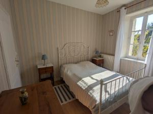 a small bedroom with a bed and a window at Gîte de Navarre in Billy +9 photos