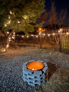 a stack of bricks in front of a fence at night at 휘게스테이 in Sejong +1 photo
