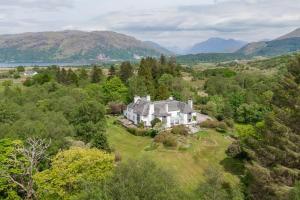 an aerial view of a house on a hill at Lonan Country House and Gardens in Taynuilt