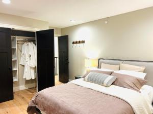 a bedroom with a large bed and a closet at Ride and Climb Lodge in Squamish