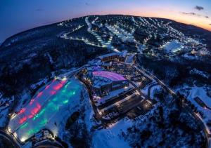 an aerial view of a city at night at Moonlight Mountain Lodge on Camelback Mountain! in Tannersville