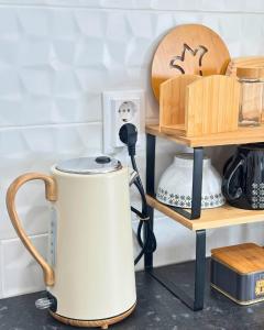 a tea kettle on a shelf in a kitchen at Casa do Pastor - Vale de Alfaia in Sobral do Campo