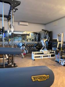 a room with a gym with a bench in it at Impero Hotel Beauty & Spa - Bike Hotel in Cantello