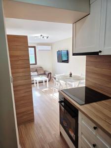 a kitchen with a living room and a dining room at Charshiq Guest House in Veliko Tŭrnovo